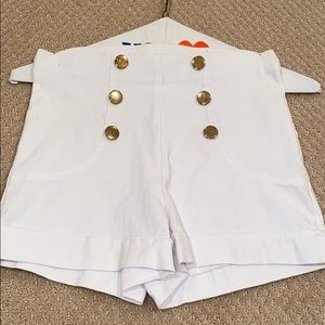 White shorts with gold buttons